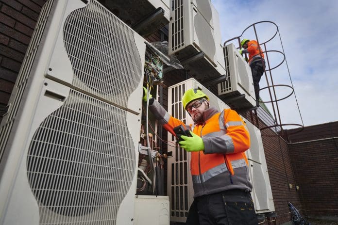 airconditioning engineers on a rooftop The evolution of facilities management in 2025