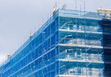 BPF joins calls on chancellor to find additional resources to clear building safety backlog Scaffolding surrounding residential development for safe access to construction work UK, representing the building safety backlog
