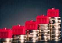 Improving payment practices in the construction industry with retention reporting requirements Small red houses stand on stacks of coins.