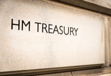 Construction industry reacts to 2025 Spring Statement HM Treasury written on the stone of the government department's building in Westminster, central London, representing the 2025 Spring Statement