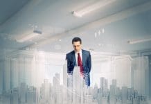 Demystifying digital twins of buildings Young businessman examining model of construction project, representing digital twins