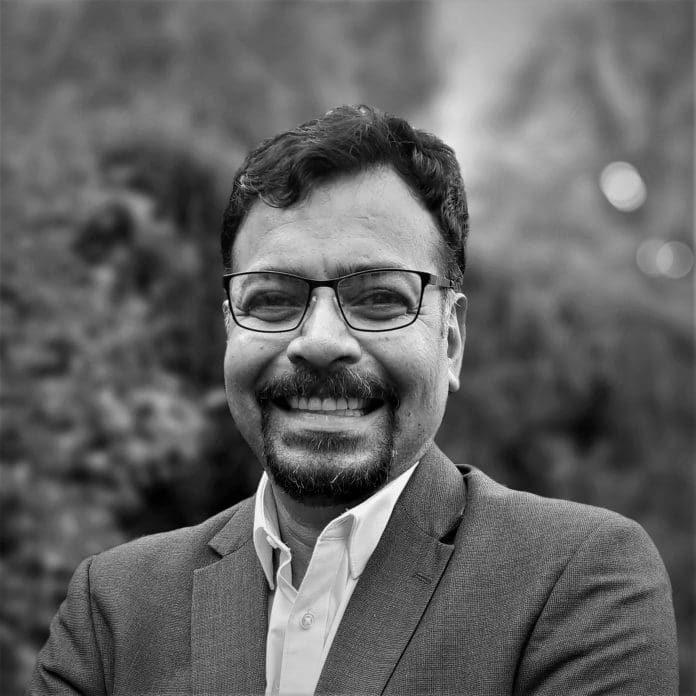 Black and white headshot of Dr Deb Upadhyaya