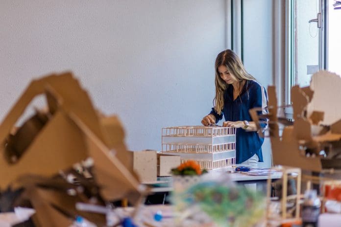 Young woman, architect working in office Young woman, architect working in office, representing Responding to the ARB’s Independent PPE Commission, RIBA has reiterated the importance of more flexible and shorter forms of study