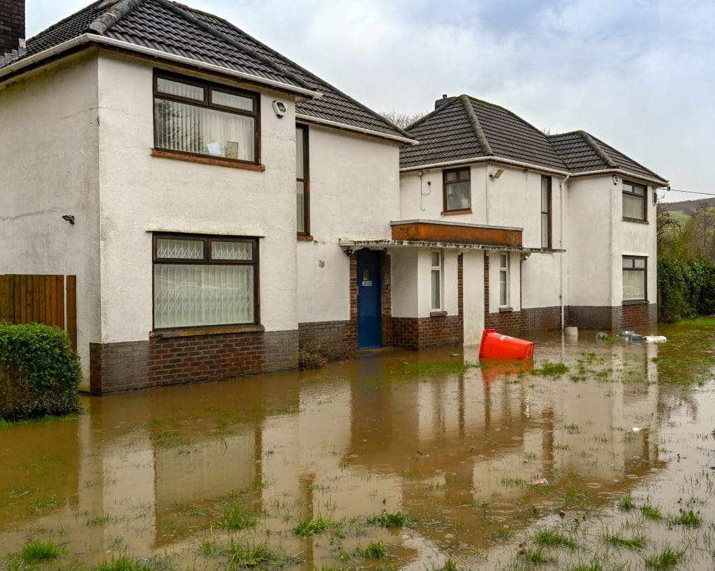 Treforest, near Cardiff, Wales - February 2020: Flooded garden of a house in Treforest after the River Taff burst its banks after rain from Storm Dennis.