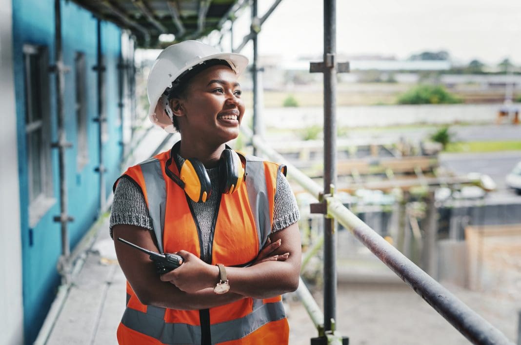 Shot of a young woman working at a construction site, representing the Top 100 Most Influential Women in Construction Awards 2025