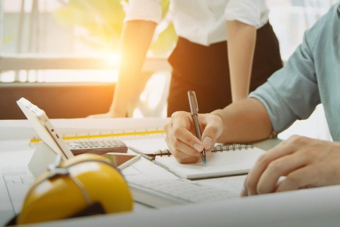 Engineer meeting in modern office with Architecture Interior Designer. Discussion to architectural project and Construction. Progress of Figures denoting of Accounting and Financial with partner, representing strategic marketing