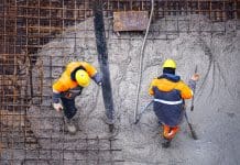 World’s first Low Carbon Ratings system for cement and concrete launched Workers pouring concrete. Concrete pouring on the construction site