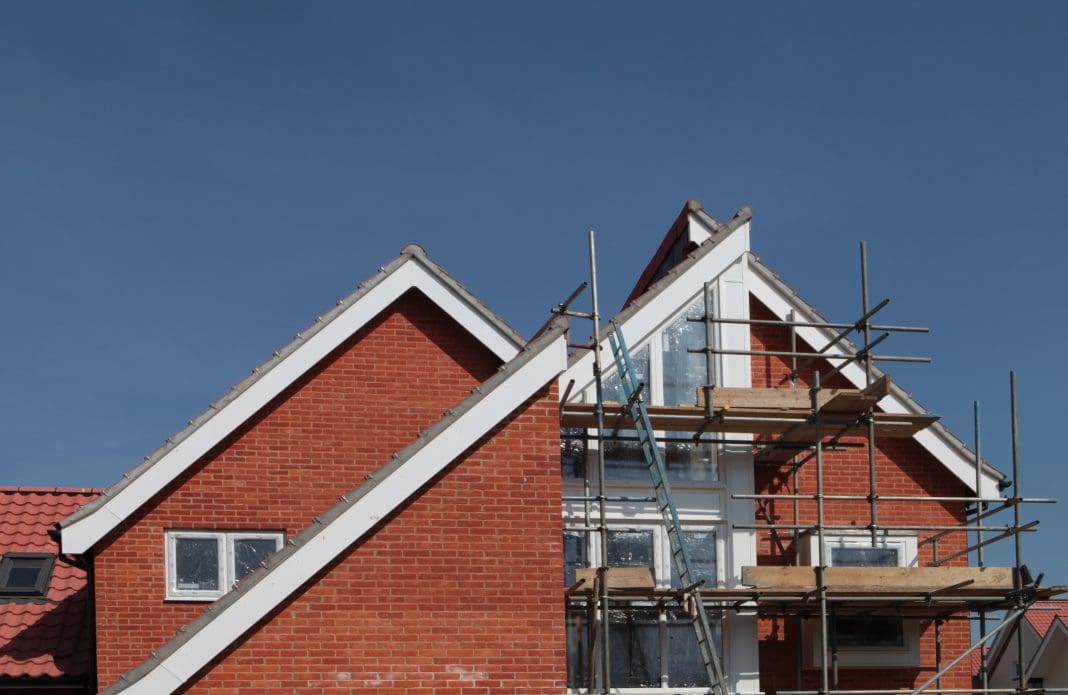 Building work on new houses - construction site, representing Structural Defects Insurance policy