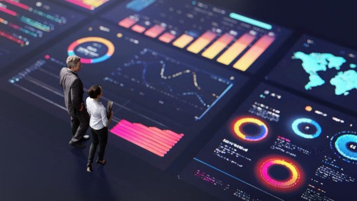 Abstract people standing on a large digital screen, analysing interactive data visualisations and charts for strategic planning. Representing teamwork, technology, and data-driven decision making in a corporate environment.