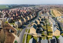 Planning reform 2025: Will fast-tracking deliver on its promise? Aerial panorama landscape view of a large new build housing development on green belt land due to a housing shortage with characterless design for first time buyers, representing planning reform