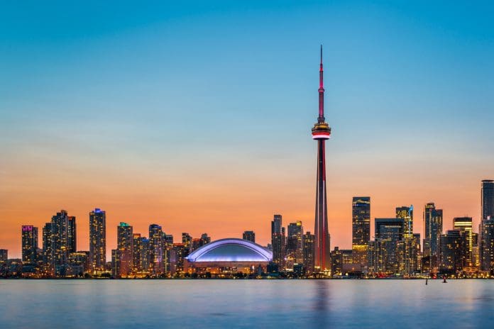 Skyline of Toronto over Ontario Lake at twilight, representing the UK-Canada agreement on architects' registration