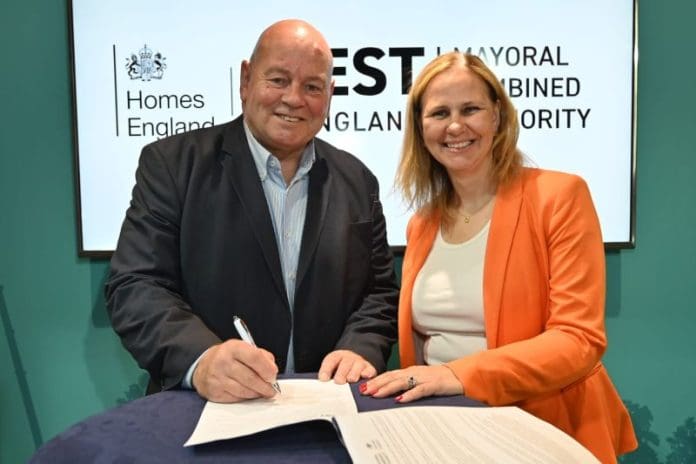 Eamonn Boylan, CEO of Homes England and Helen Godwin, Mayor of the West of England Mayoral Combined Authority, signing the Homes England Strategic Place Partnership