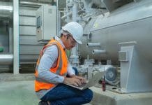 The massive challenge for construction as PFI agreements come to an end An,Engineer,Man,Or,Worker,,People,Using,A,Laptop,Computer, representing the impact of PFI agreements