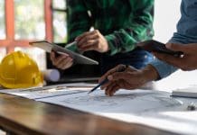 Missed deadlines in architecture, engineering and construction — and how to fix it Construction and structure concept planning of Engineer or architect meeting for project working with partner and engineering on model building and blueprint in working site, representing Missed deadlines in architecture