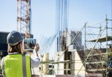 International Women in Engineering Day- Deltek’s Sigrun Gisladottir speaks on feeling ‘seen and heard’ Female construction engineer taking photo of site with digital tablet
