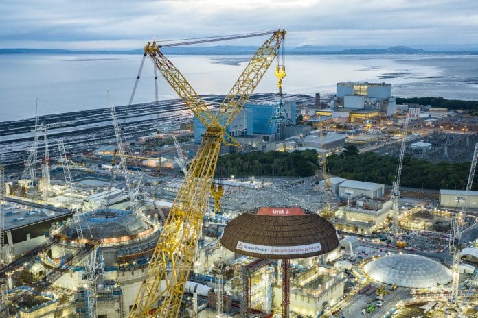 The world's largest crane, Big Carl, lifting the dome into place at Hinckley Point C's Unit 2