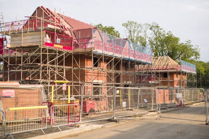 New build homes in a housing development, UK Buckinghamshire, UK - May 18, 2024. New build homes under construction in a housing development, UK