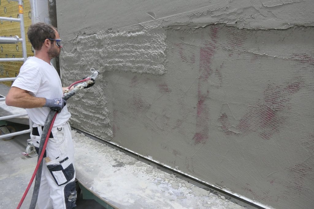 A layer of pull-off mesh is added to a test construction of the Drastic project’s German Demonstrator’s External Thermal Insulation Composite (ETIC) system. 