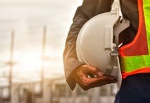 UK construction industry safety: A shocking rise in fatal injuries Technician holding white hat safety hard hat sunlight background, representing the need for preventative measures against Construction fatal injuries