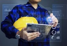 Why a single source of truth is vital for AEC project success Facility management concept with engineer using tablet to monitoring single line diagram of building or factory to manage devices operation records data and scheduling for maintenance plan