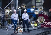 What makes a project paradise? Lessons from AEC leaders Two mature multiracial women wearing hardhats walking side by side through a warehouse. Digital graphics overlayed on the foreground show various people at work in industrial settings, representing a large global manufacturing network.