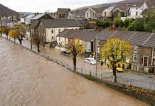 Integrated retrofit for resilience: Why the UK must act now Pontypridd, Wales, UK - 24 November 2024: Flooding in a street near the town centre after the River Taff burst its banks following heavy rain from Storm Bert
