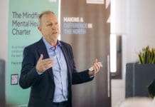 Building strength, together: How football can help change the game for mental health in construction Mindflow discussing mental health in construction at the Charter event in Liverpool