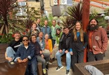 Retrofit Connect: A new chapter for community-led action A group of taking part in Retrofit Connect sitting and standing looking towards the camera