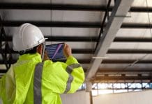 New 3D laser scanning webinar to unlock smarter construction workflows Construction Civil Engineer use technology software through tablets to scan building construction and inspection to show augmented reality in work, Building information model or BIM concept