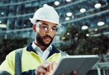 Transforming legacy systems with Vantagepoint at Maynard Marks Tablet, civil engineer and man in city for building, development and planning at dawn. Technology, construction and architect outdoor for maintenance, safety inspection and infrastructure project, representing the benefit of updating legacy systems