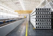 Building smarter: Making the case for industrialised construction in the UK Stack of reinforced concrete slabs in a house-building factory workshop, representing industrialised construction