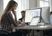 Heralding a new era of active model-based planning Young colleagues working in the office, representing model-based planning