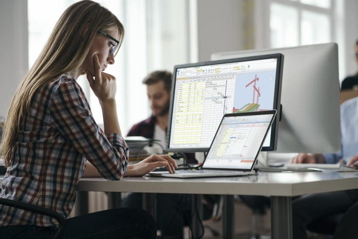 Heralding a new era of active model-based planning Young colleagues working in the office, representing model-based planning