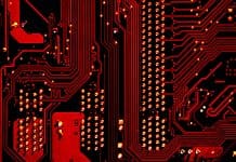 Using AI responsibly in the surveying profession overview of a circuit in red light, representing responsible use of AI