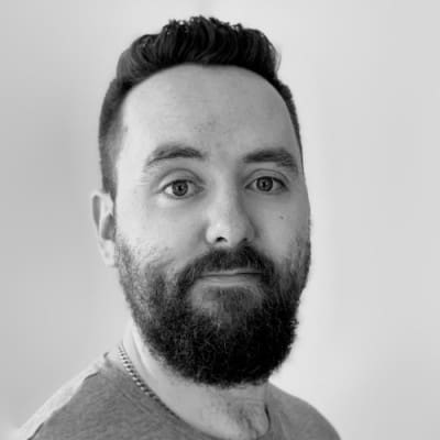 A black and white headshot of Dan Ring of Chaos