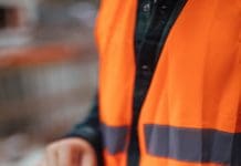 Resilient delivery starts with better Project Information Management Unrecognizable construction worker using a digital tablet while working at a building site, representing Project Information Management