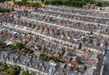 Retrofit: Bridging social and private rental for equitable standards Aerial view of old terraced houses on back to back streets in the suburbs of a large UK city, representing equitable retrofit