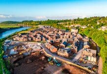 New towns need decisive action to scale housing delivery Drone view of new housing development being built in the UK