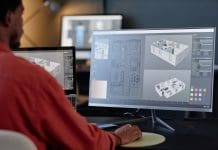 Why digital modelling must start at the policy stage Man working on architectural designs on dual computer screens in an office environment. Concentrating on details of building layout and structure on screen