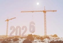 Glenigan Autumn Forecast predicts UK construction to return to growth in 2026 Prepare to welcome the new year 2026. Large construction site, construction cranes set numbers 2026. Construction team sets numbers for New Year 2026, representing the latest glenigan forecast
