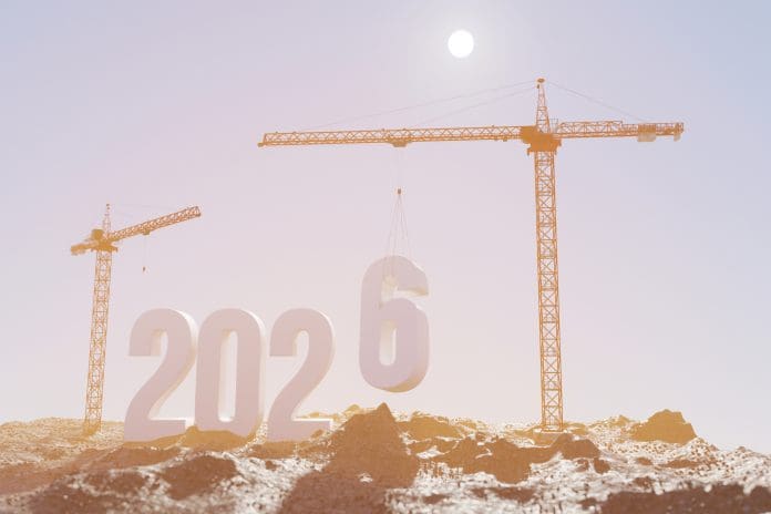 Glenigan Autumn Forecast predicts UK construction to return to growth in 2026 Prepare to welcome the new year 2026. Large construction site, construction cranes set numbers 2026. Construction team sets numbers for New Year 2026, representing the latest glenigan forecast