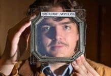 New clear insulation material could make windows much more efficient Abram Fluckiger holds up a sample panel square that has five sandwiched layers of a new material nearly transparent insulation material called MOCHI, which was designed buy CU Boulder researchers in physics professor Ivan Smalyukh’s lab. Credit: Glenn J. Asakawa/CU Boulder