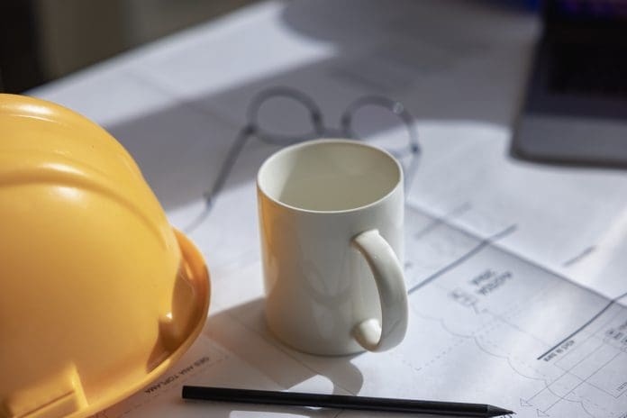 Architectural and Engineering Office Desk Background, Featuring Construction Project Ideas and Drawing Equipment.