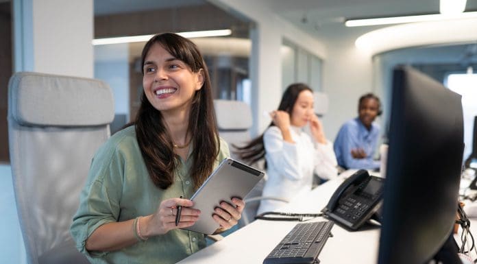 Group of young coworkers using computers in their group office, representing the new online appeals service
