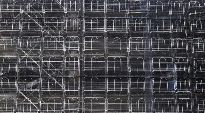 Abstract background of construction site with scaffolding the building cover.