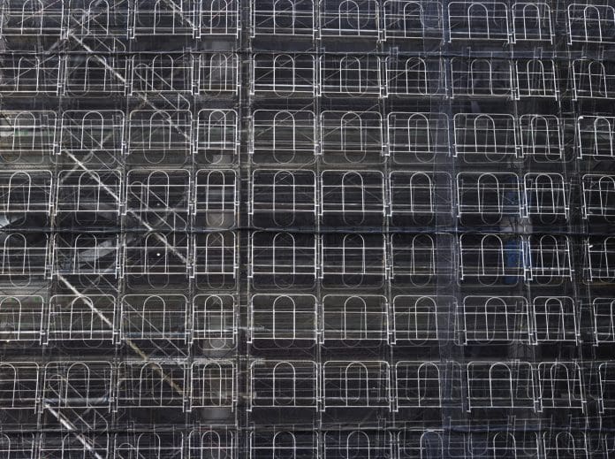Making scaffolding more sustainable Abstract background of construction site with scaffolding the building cover.