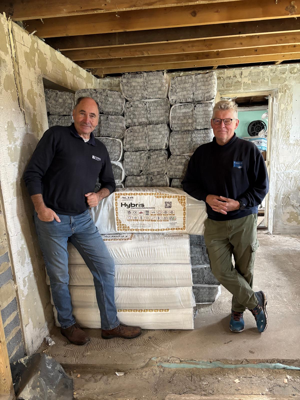 Paul White (left) from Youngs builders merchant in Dymchurch at the former chalet bungalow into which Tony Shepherd from Riveroak Ltd has breathed new life, with a helping hand from the Actis Hybrid inrange