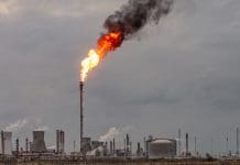 Waste heat from industry could be secret weapon to net zero, says Royal Society Environmental damage: A large flame and dark smoke rising from a flare stack at Grangemouth oil refinery and petrochemical plant in Scotland.