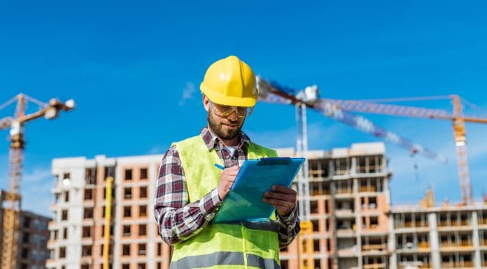 Successful engineer working at construction site