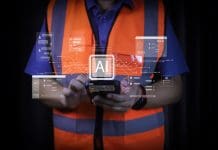 Identifying risks in construction with AI Industrial technician using mobile app to query data from AI chatbot. Smart factory worker consulting artificial intelligence for problem solving. Future construction communication. AI in construction is prophesised to bring productivity gains- but arguably the greatest transformation could lie in how risk is identified